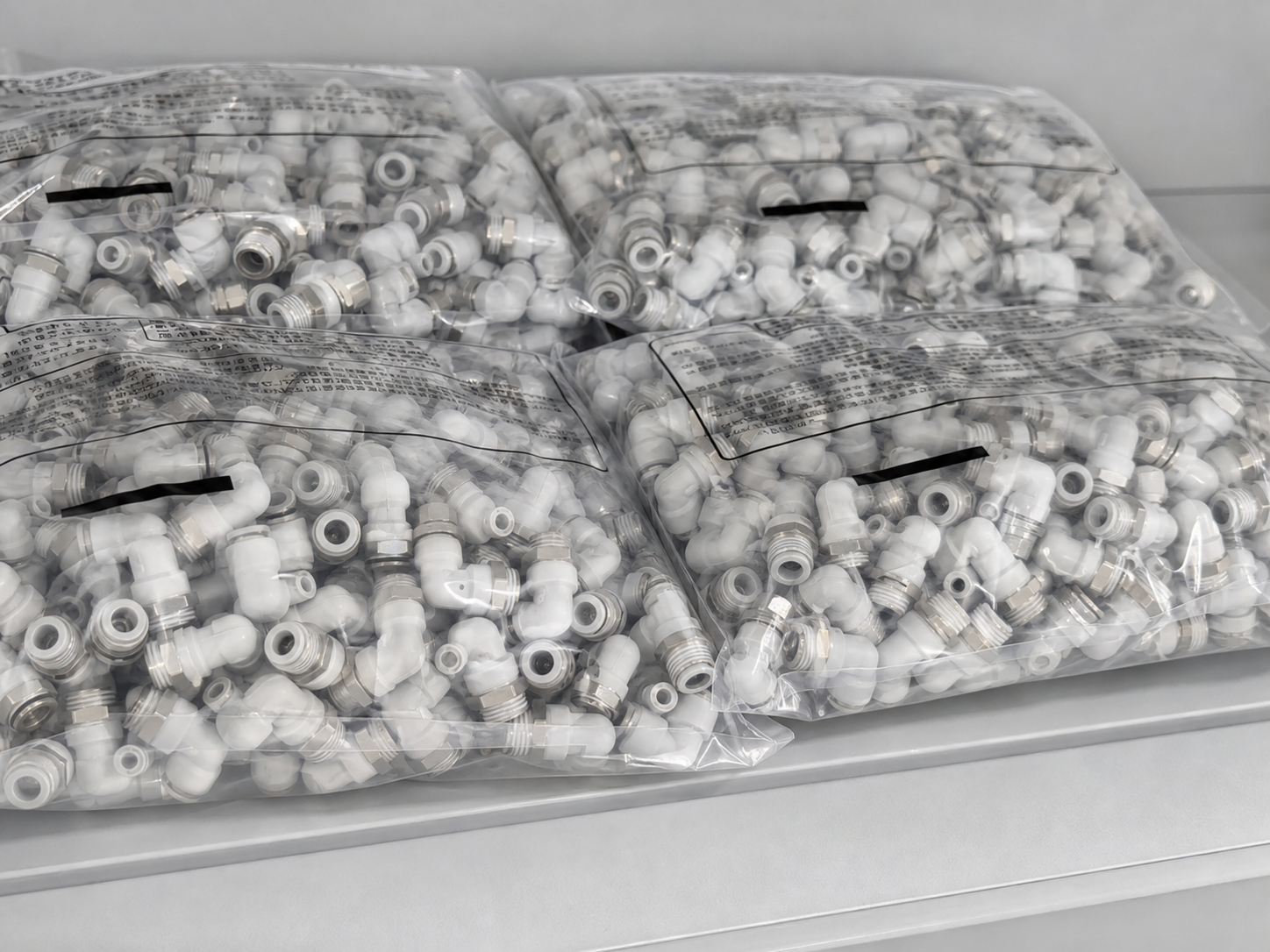 Organized bagged PL elbow fitting inventory based on HOLID factory footage